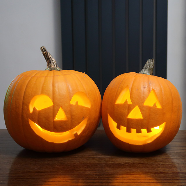 Two fairly large carved pumpkins