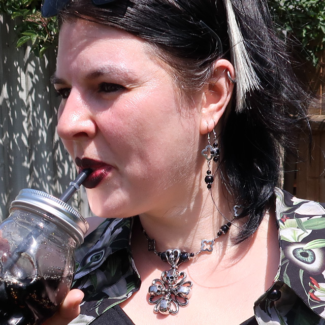 Wearing the skull cross necklace