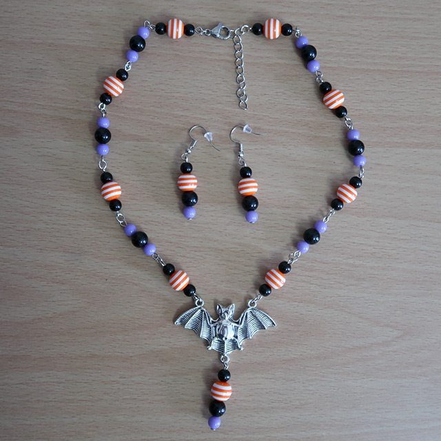 Striped Bat necklace and earrings (overhead view)