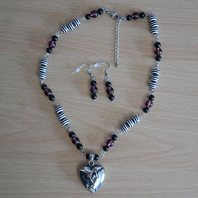 Broken Heart necklace and earrings (overhead view)